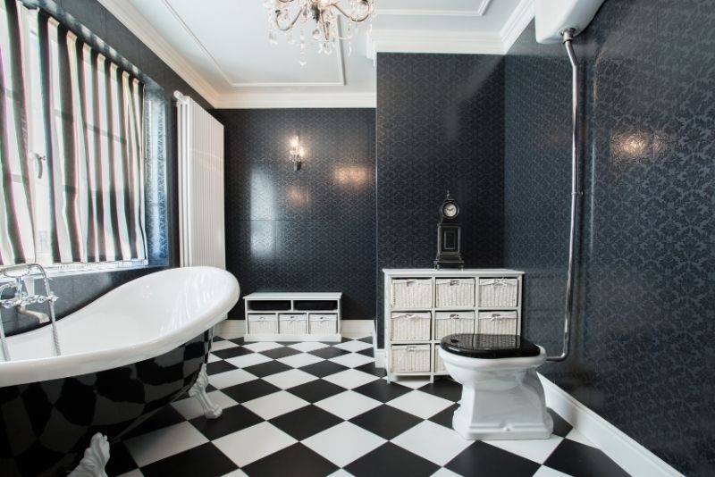 huge bathroom tub and a patterned wall