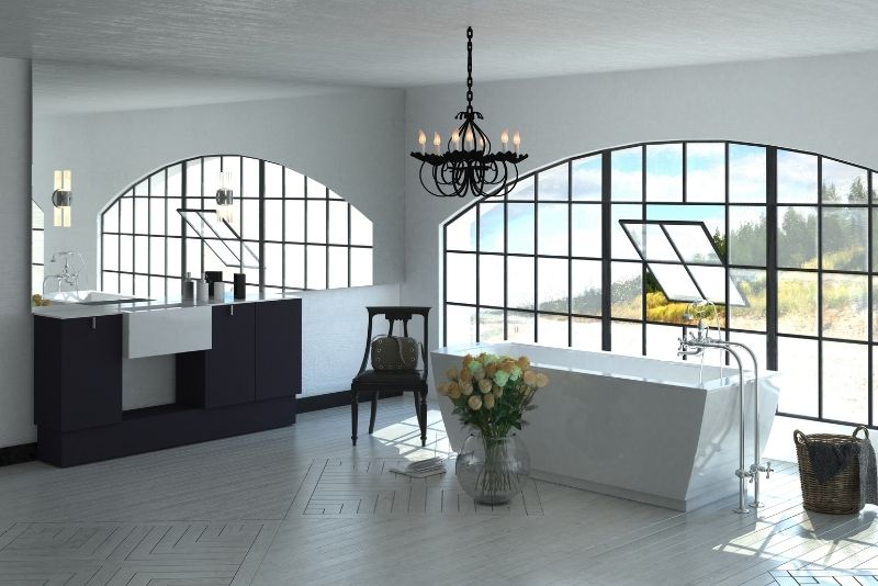 luxury bathroom design in a huge space with a bath tub near the window