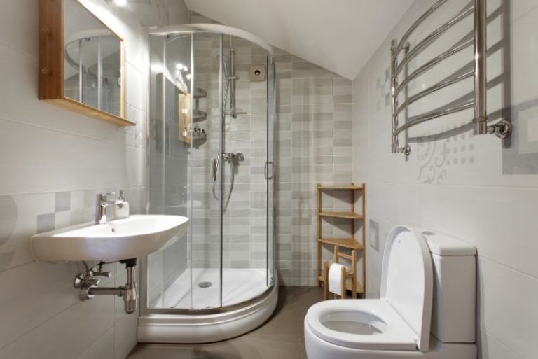 Built-in bathroom storage cabinetry keeping toiletries out of sight